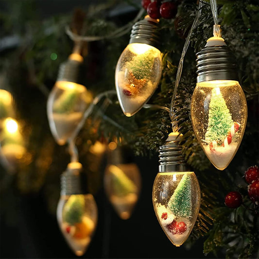 10 led snow globe bulbs filled with faux pine, snow, and miniature ornaments